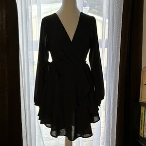 Size small little black dress with tie around the middle.